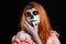 Portrait image of redhead woman, who is ready for the Halloween.