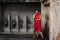 Portrait images of Girl wearing red Cheongsam dress Standing and holding a broom