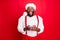 Portrait of impressed black santa claus in xmas hat screaming wow omg use cell phone modern technology got noel
