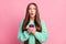 Portrait of impressed frightened person staring open mouth teal sweater  on pink color background