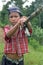 Portrait Indian boy with bamboo fishing rod