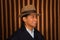 Portrait of indigenous young man wearing traditional hat and poncho from Otavalo, Ecuador