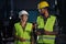 Portrait of industrial inspectors doing a general check up indoors at metal workshop.