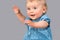 Portrait of infant waving hands