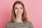 Portrait of interested funny lady look side empty space toothy smile on pink background