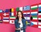 Portrait of interpreter and flags of different countries on pink background