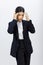 Portrait isolated cutout studio shot Millennial Asian professional successful female businesswoman in formal business suit holding