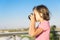 Portrait of a ittle girl taking photographs outdoors