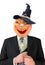 Portrait of Jack Lantern from pumpkin in black business suit. Jack Lantern keeps money in his hands.