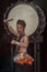 Portrait of a Japanese drummer Taiko with drumsticks and big drum