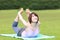 Portrait of Japanewe woman doing yoga frog pose