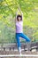 Portrait of Japanewe woman doing yoga tree pose