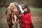 Portrait Jockey woman rider with brown horse, concept advertising equestrian club school