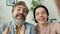 Portrait of joyful family man and teenager making online video call speaking and gesturing at camera