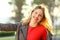 Portrait of a joyful fashion woman in a park