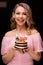 Portrait of joyful fashion woman posing holding cake candles happy birthday