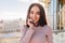 Portrait joyful smiled brunette young woman in sunny morning chilling on terrace. Smiling to camera, expressing positive