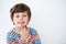 Portrait, kid and boy thinking in studio isolated on a white background mockup space. Face, idea and young child with