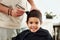 Portrait, kid and shaving hair at barber for grooming, cleaning and trim. Smile, face and happy boy or child getting a