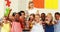 Portrait of kids and teacher doing thumbs up in laboratory