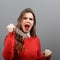 Portrait of killer woman with knife against gray background