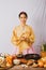 Portrait korean asian beautiful woman wearing golden hanbok, preparing food, folk wisdom Korean Recipes Kimchi Pickles, she is hap