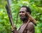 The Portrait Korowai man hunter with arrow and bow. Tribe of Korowai Kombai , Kolufo.