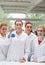 Portrait of lab partners posing with a flask