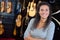 Portrait lady in guitar shop