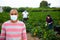 Portrait of latino farmer in protective mask