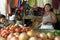 Portrait of Latino market vendor in vegetable stall