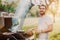 Portrait of laughing handsome guy having a great time at barbecue grill party, cooking and drinking beer