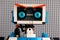 Portrait of Lego BOOST robot against gray baseplate background