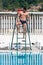Portrait Of A Lifeguard Man At Swimming Pool