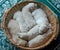 Portrait of a litter of an adorable golden retriever puppies or babies sleeping in a wicker basket