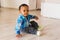 Portrait of a little african american baby boy playing indoor
