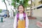 Portrait little Asian child girl with student shoulder schoolbag walking on walkway go to school. Back to school concept