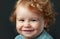 Portrait of little baby. Concept of kids face close-up. Head shoot children portrait. Smiling infant, cute smile.