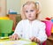 Portrait of little blonde girl with blue eyes