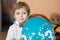 Portrait of little boy with baloon at his 3 birthday