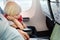 Portrait of little boy with his father during traveling by an airplane