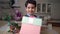 Portrait of little boy offering gift box on camera