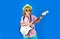 Portrait of little boy in pink sunglasses playing electric guitar. Kid boy playing guitar. Musician child with a guitar