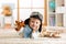 Portrait of little boy playing with wooden airplane