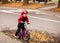 Portrait of a little boy siting on balance bike