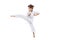 Portrait of little boy, sportsman training, practising martial art, karate isolated over white background