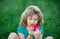 Portrait of little boy in summer nature park. Concept of kids face close-up. Head shoot children portrait.