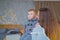 Portrait of little boy on wooden rocking horse