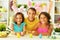 Portrait of little brother and sisters painting traditional Easter eggs