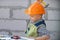 Portrait of little builder in hardhats with instruments for renovation on construction. Builder boy, carpenter kid with